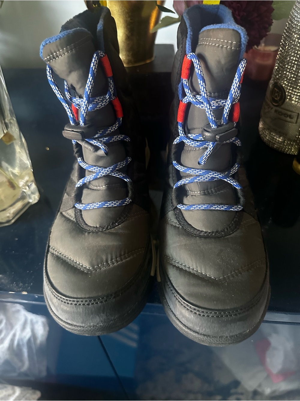 Sorel Kids Black Winter Boots with Blue Laces and Red Accents